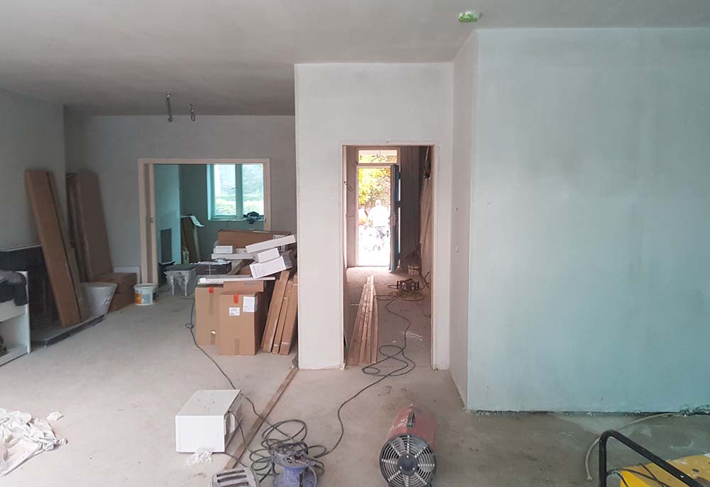 Fresh plastered walls of a open plan living room